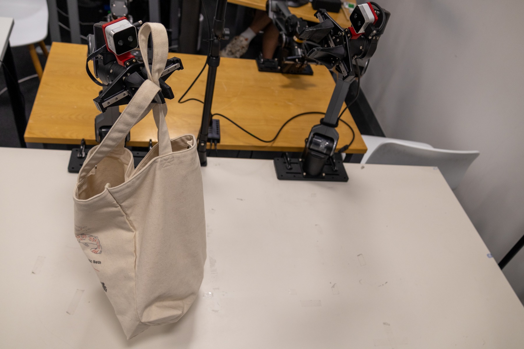 Representative real-world bimanual manipulation task evaluated with AutoIntervene